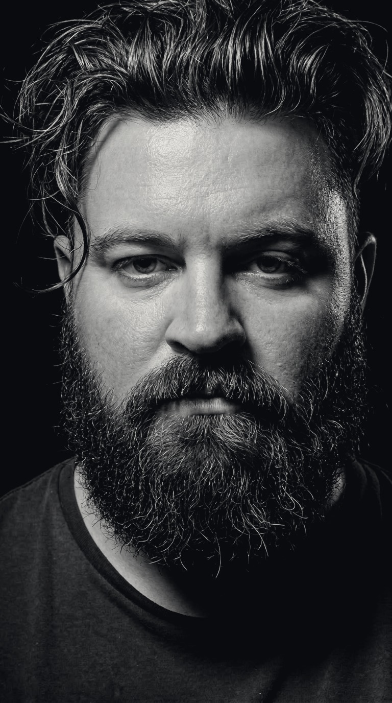 Black-and-white portrait of KALUS